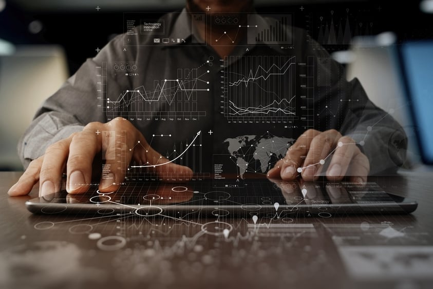 businessman hand working on laptop computer with digital layer business strategy and social media diagram on wooden desk.jpeg